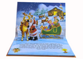 Pop-up book page with Santa Claus and reindeer in a snowy scene