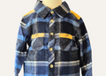 Close up of the mustard accents on the boys blue checked shirt which is  part of a 2piece set