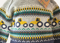 Close up of the tractor design on the knitted jumper of the 2 piece set from Lily & Jack