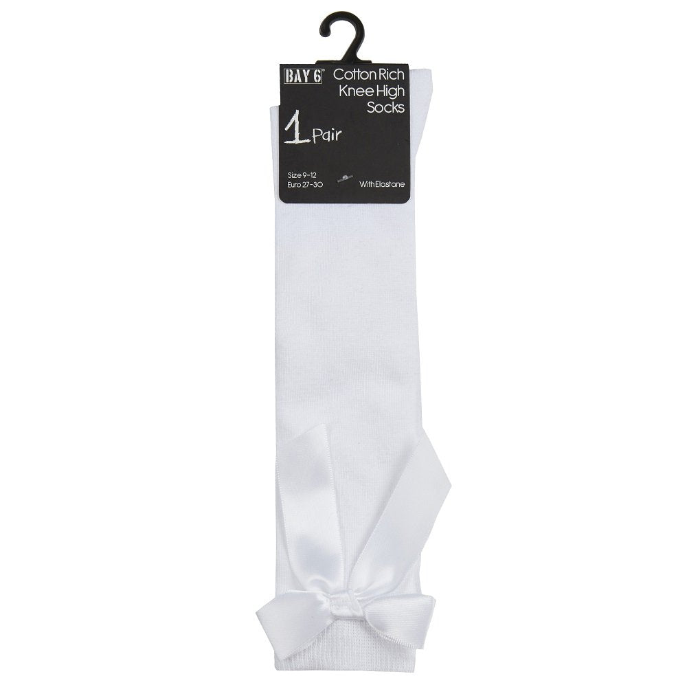 White knee-high sock with a bow on a white background