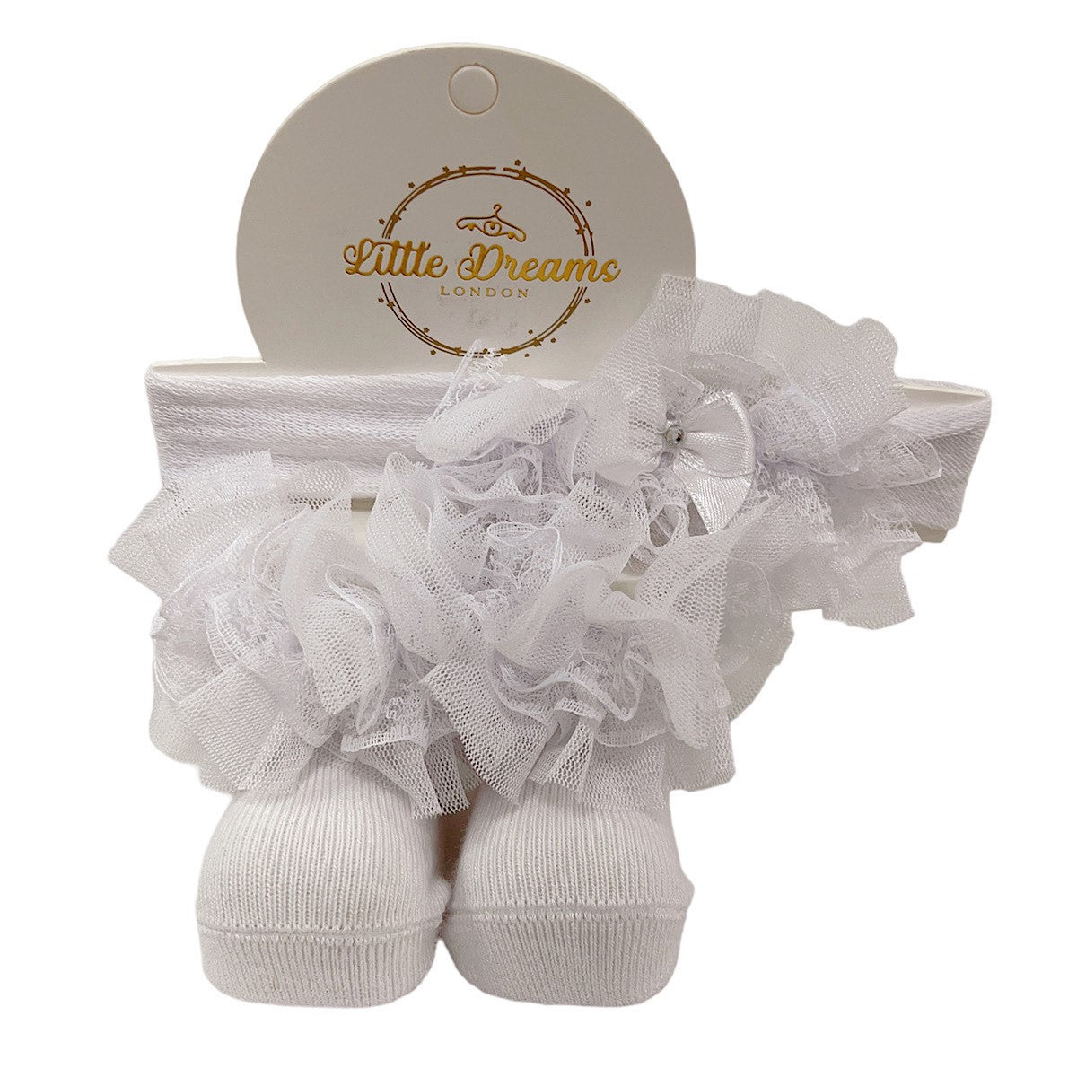 White baby socks with ruffles on and  a matching headband on a white background, branded 'Little Dreams London'.