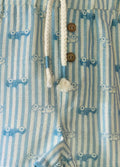 Close-up of a blue and white striped pair of shorts with buttons and drawstrings.