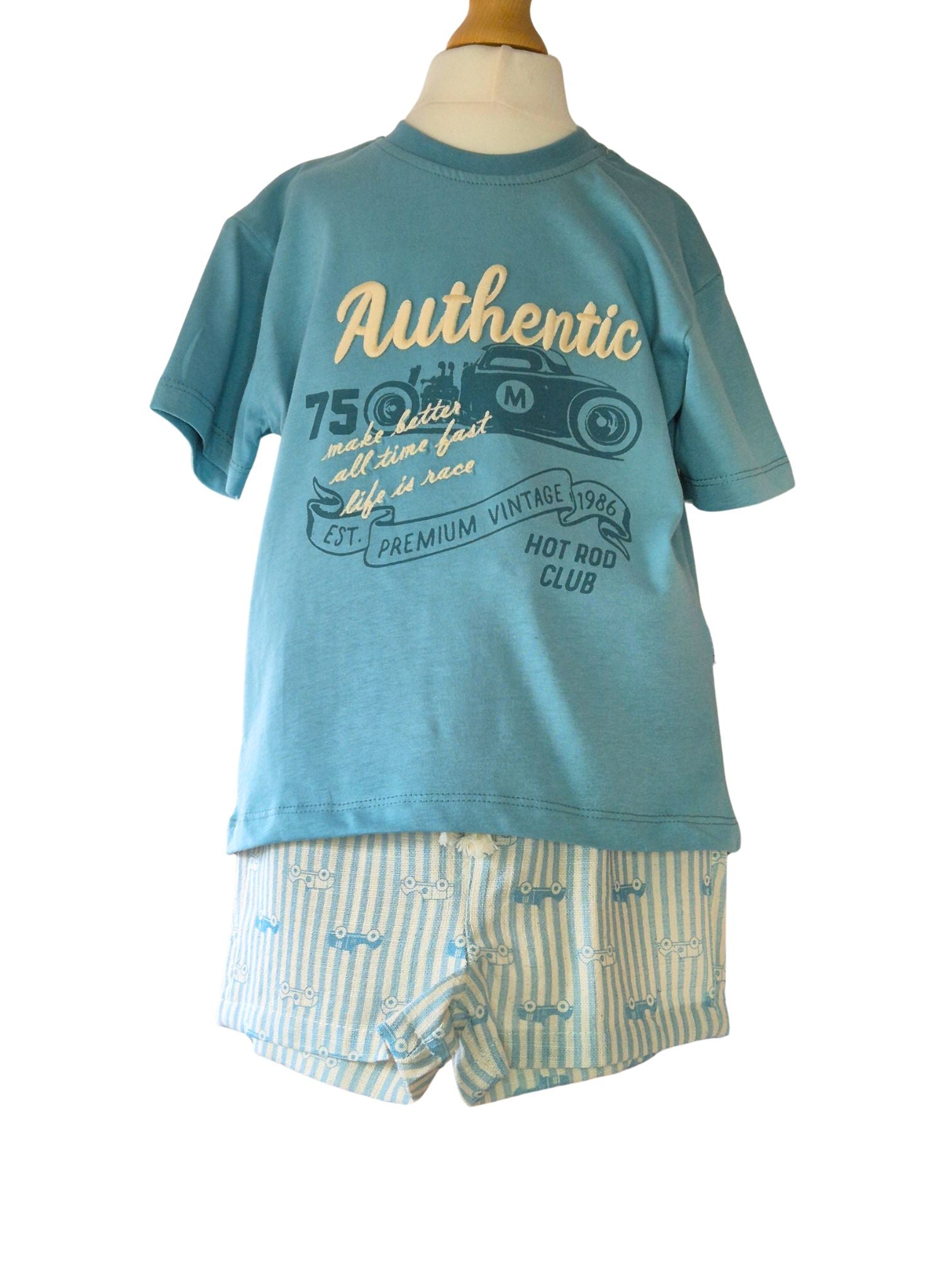 Children's blue t-shirt with text and shorts on a mannequin against a white background