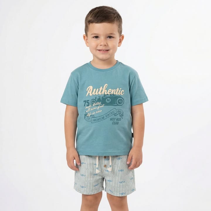 Child wearing a blue t-shirt with text and graphics on a white background