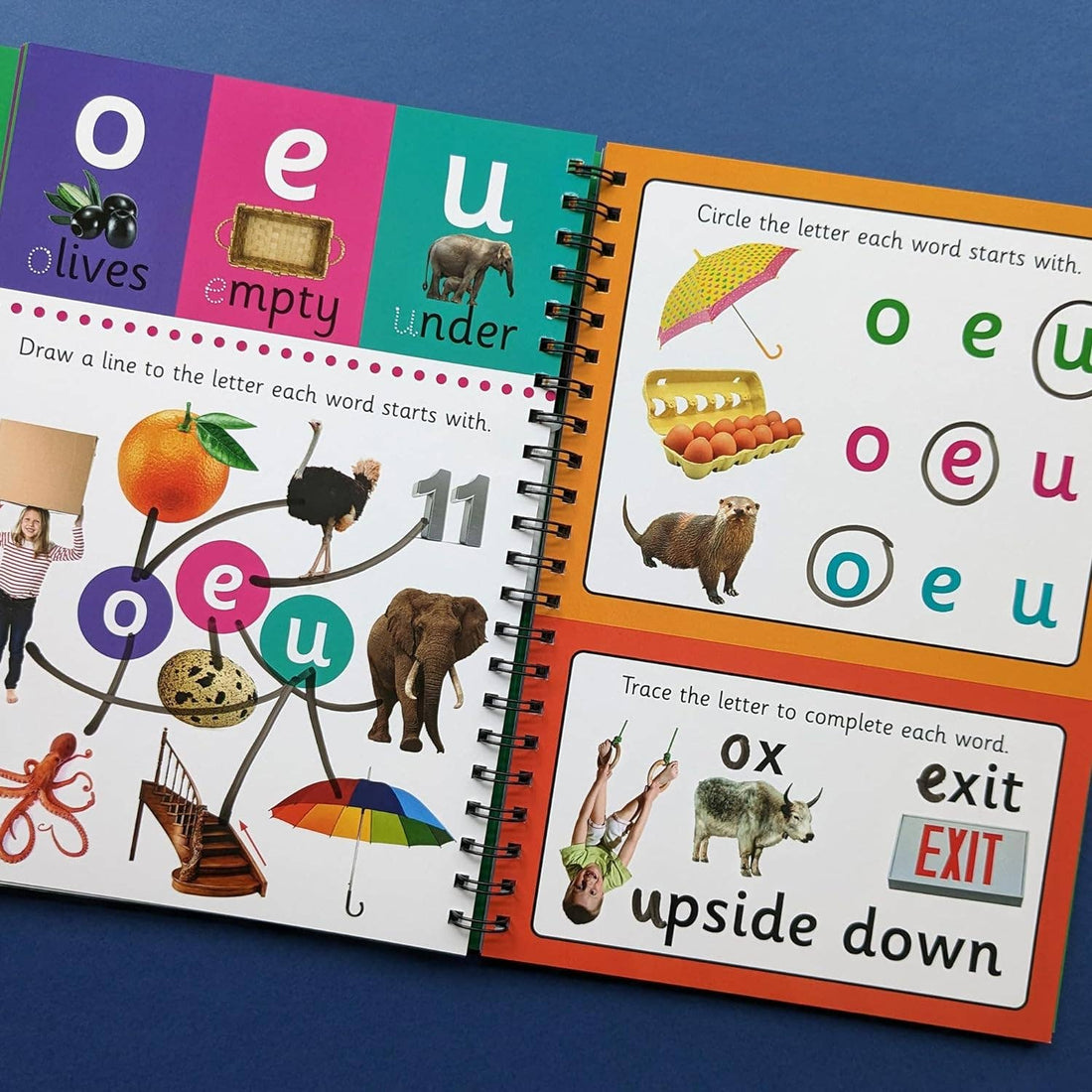 Book cover of 'Phonics Ages 3-5' with animals and words on a green background