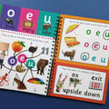 Educational book with alphabet activities on a blue background