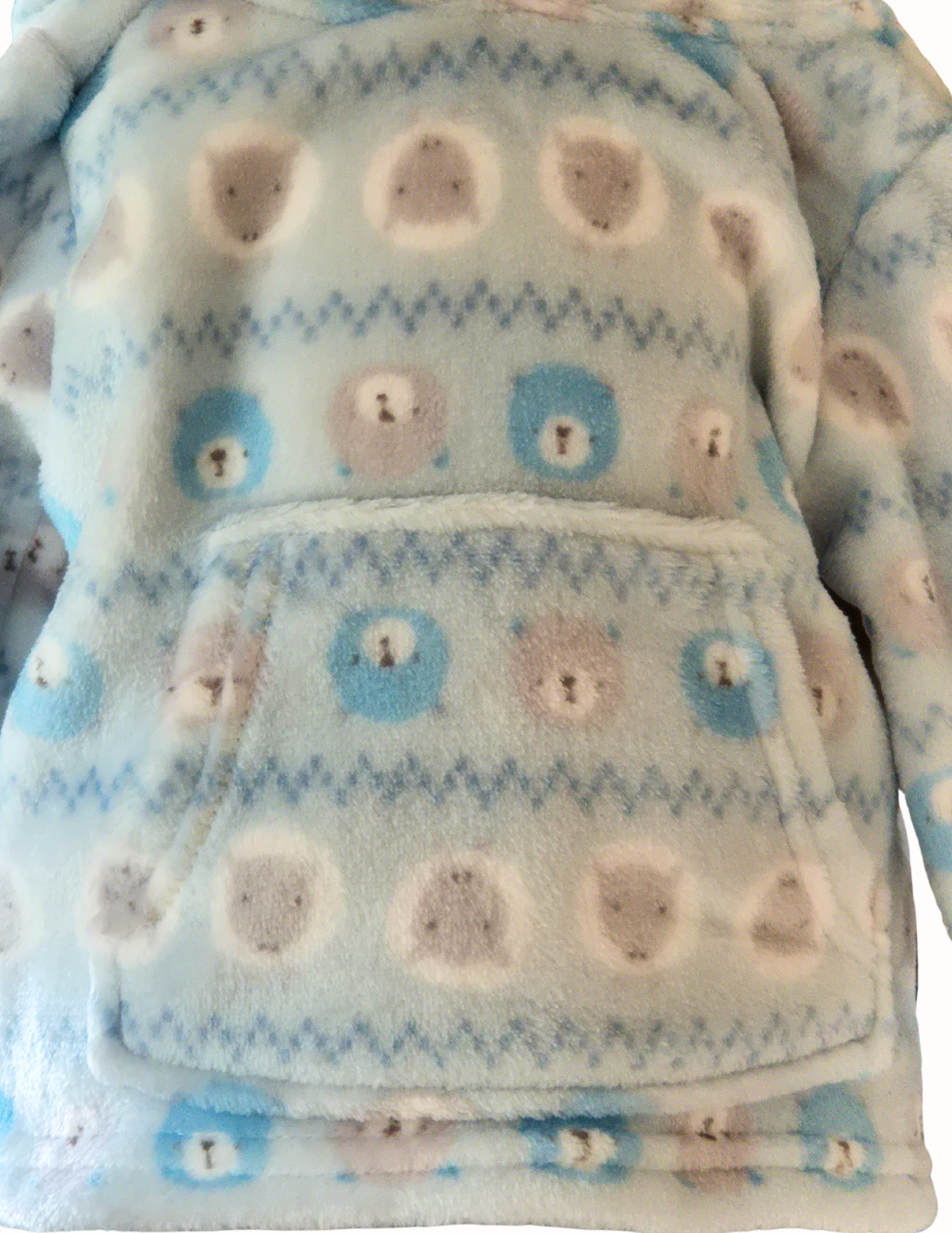 Close up of the fleece material showing the bear and sheep design