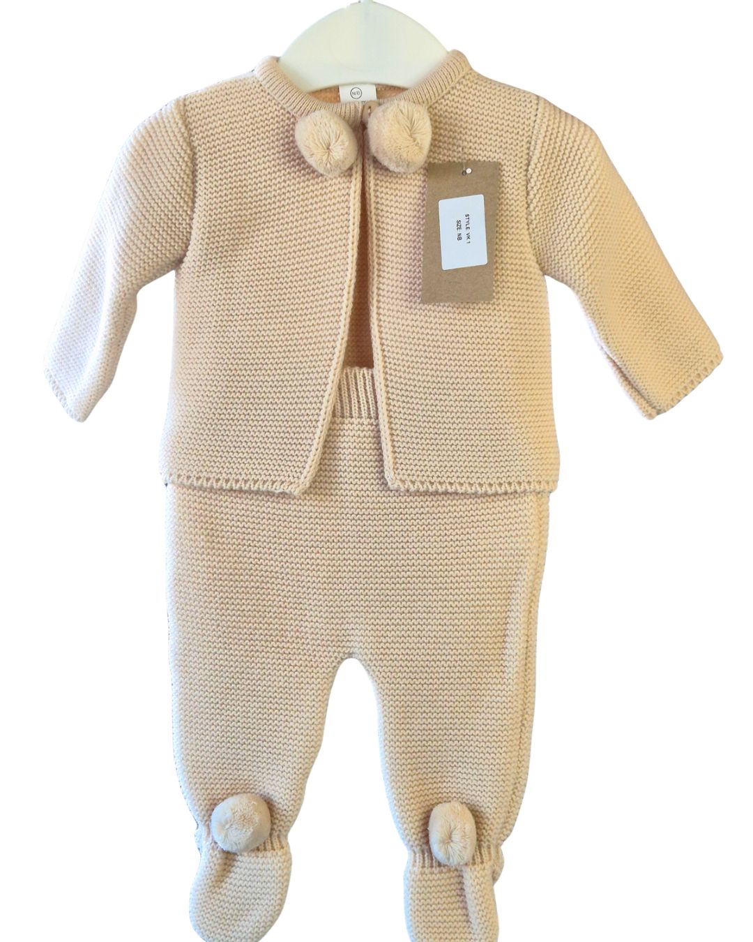Soft beige knitted newborn baby cardigan and footed trousers set with matching pom pom details