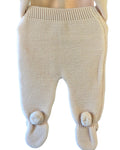 Beige knitted baby trousers with pom pom feet