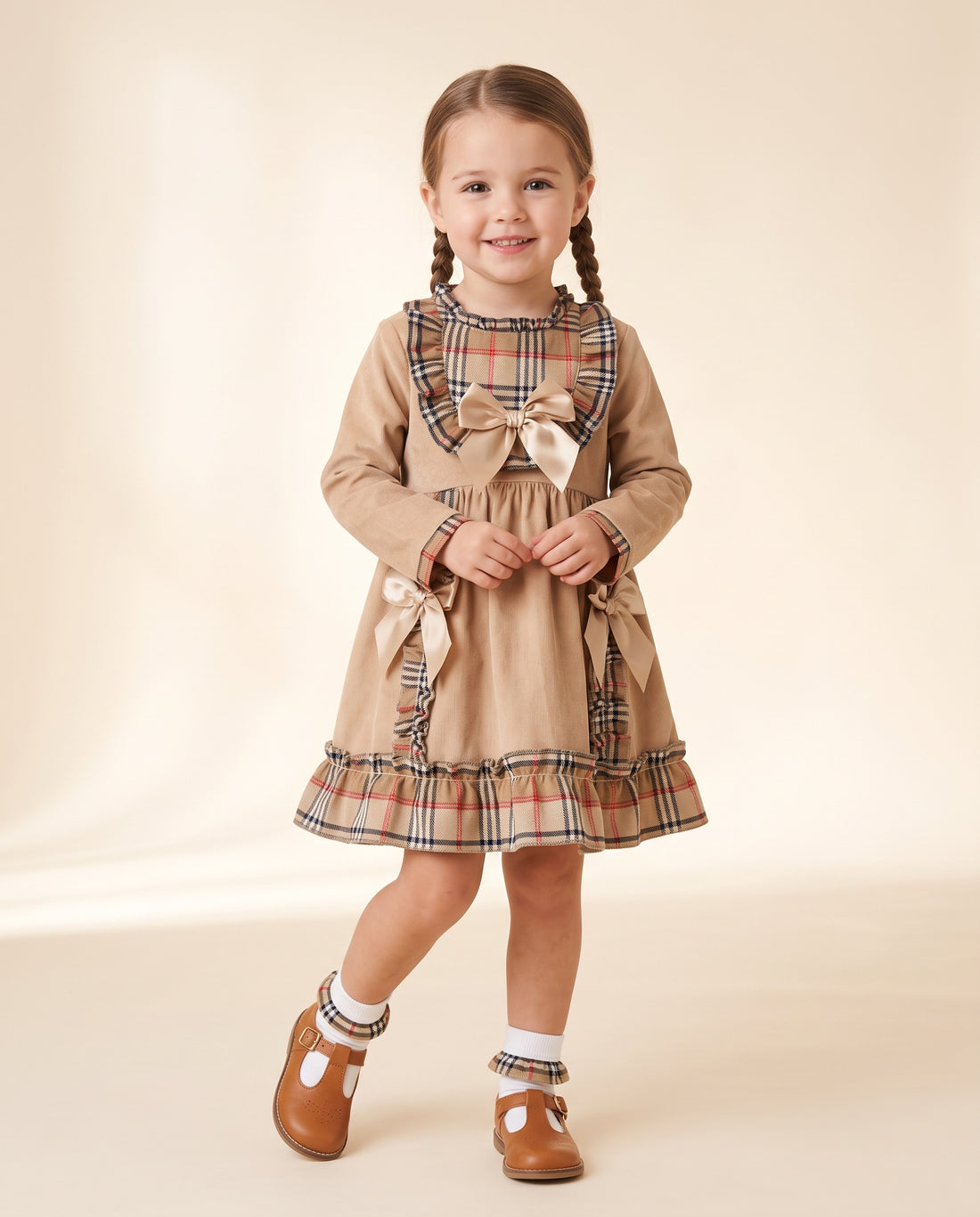 Girls beige cord and tartan dress with frills and bows