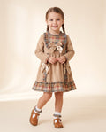 Girls beige cord and tartan dress with frills and bows