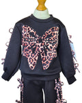 Girls black long sleeve top with animal print bows