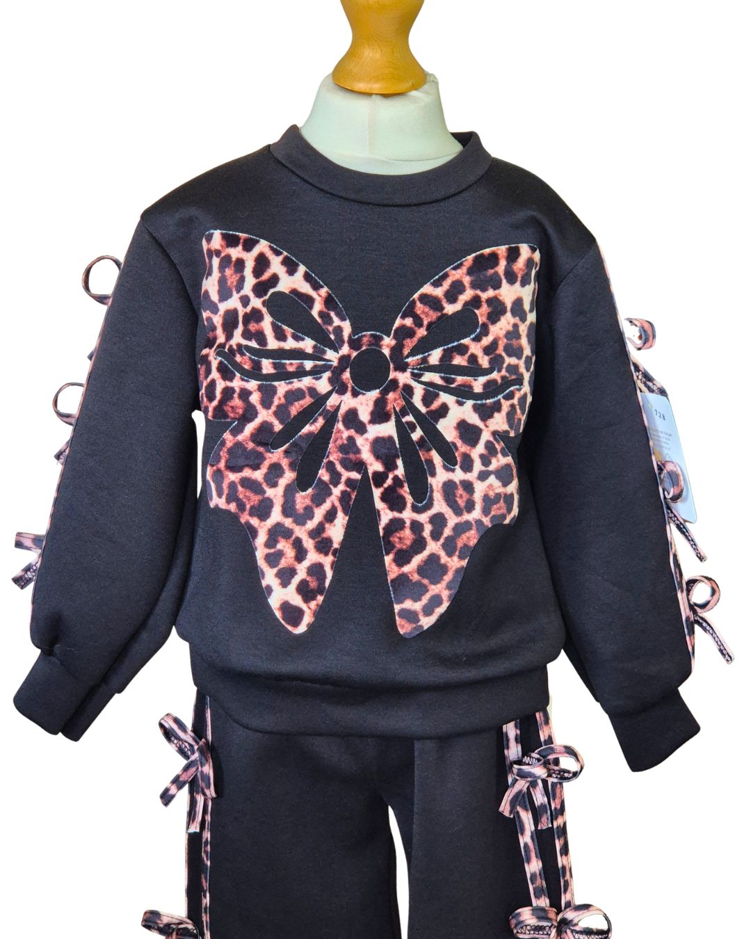 Girls black long sleeve top with animal print bows