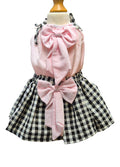 Toddlers top with pink bows and black and white checkered pattern skirt on a mannequin.