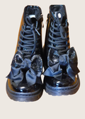 Pair of girls black patent boots with sparkly bows on the front