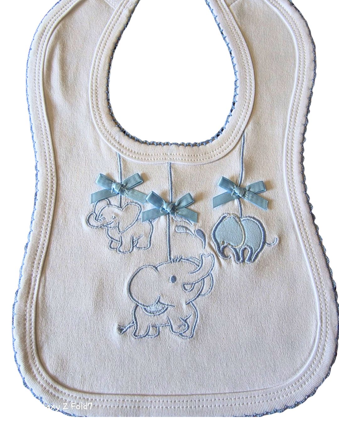Baby bib with blue satin ribbon bow detail