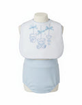 White baby bib with blue scalloped edging