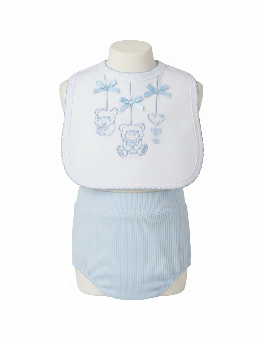 White baby bib with blue scalloped edging