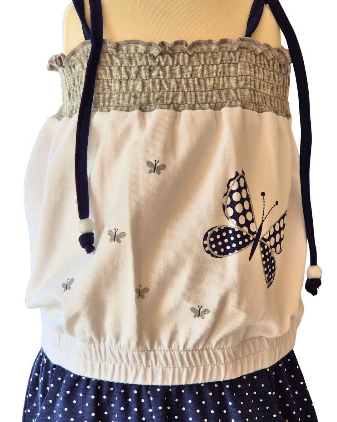 Blue polka dot playsuit with tie straps and bead detail