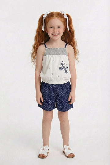Children’s blue polka dot summer playsuit with butterfly detail