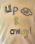 Embroidered text 'up & away!' on a fabric background