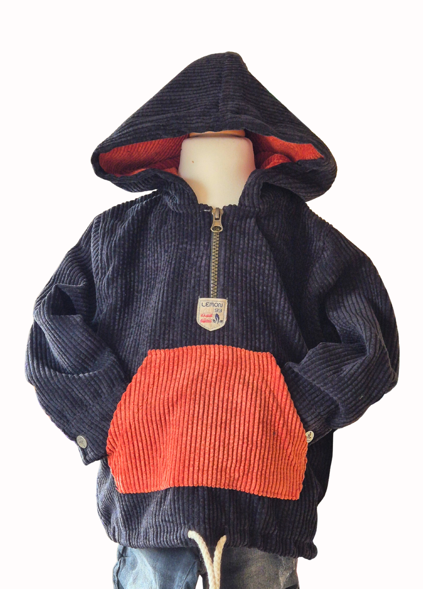 Black and rust hooded jacket on a mannequin against a white background