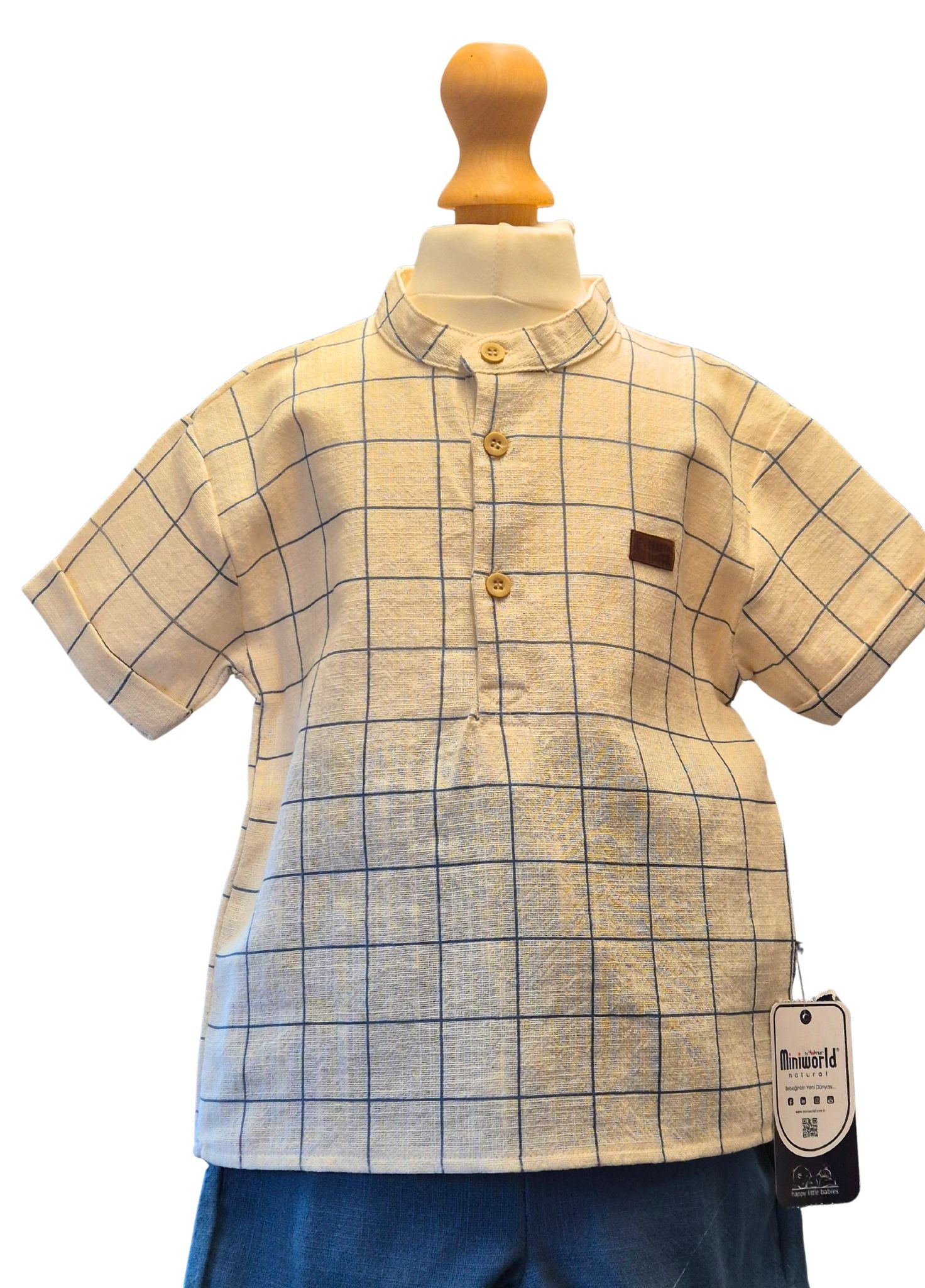 Plaid shirt on a mannequin with a visible brand tag against a white background