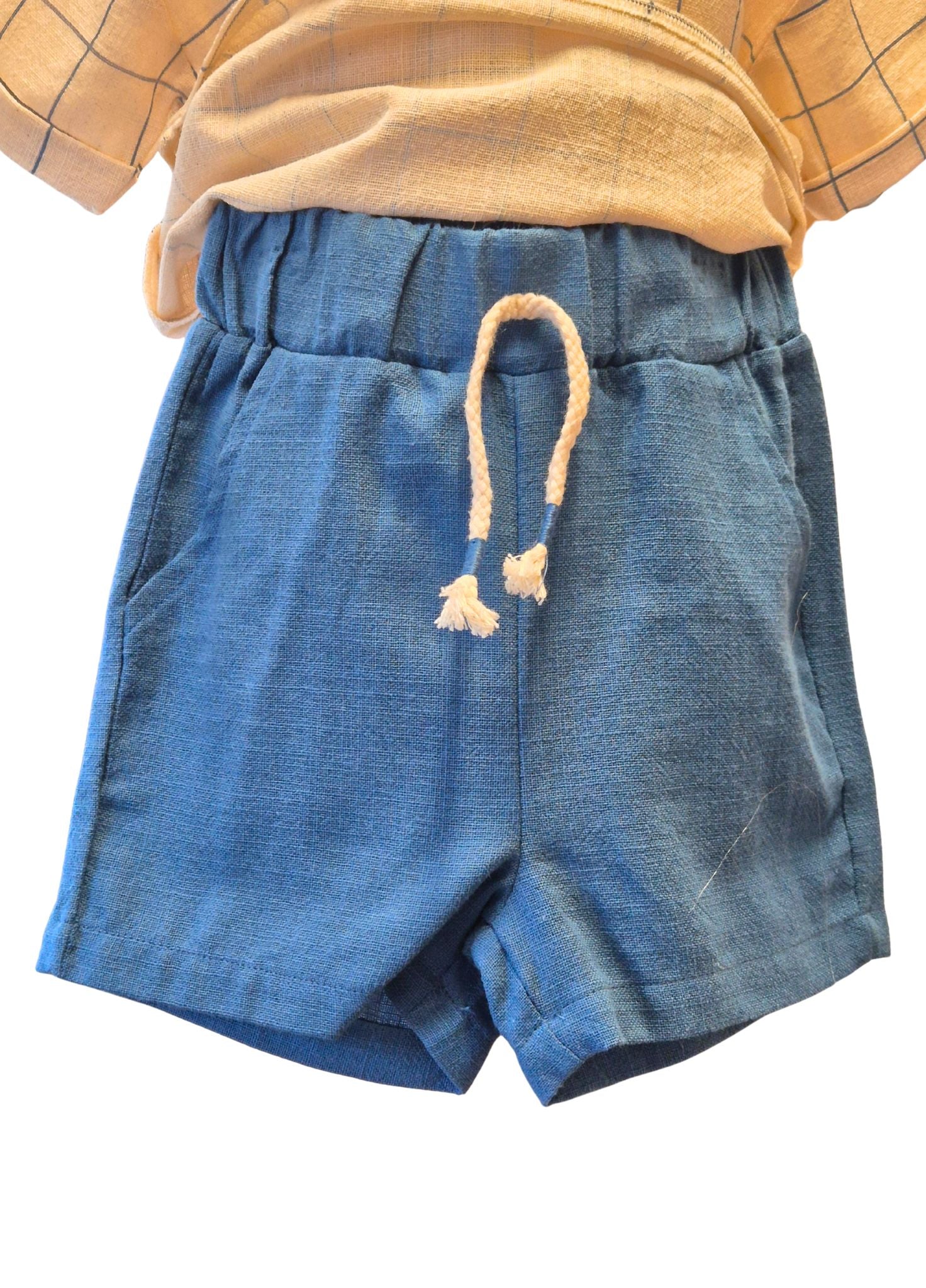 Blue shorts with a plaid shirt on a white background