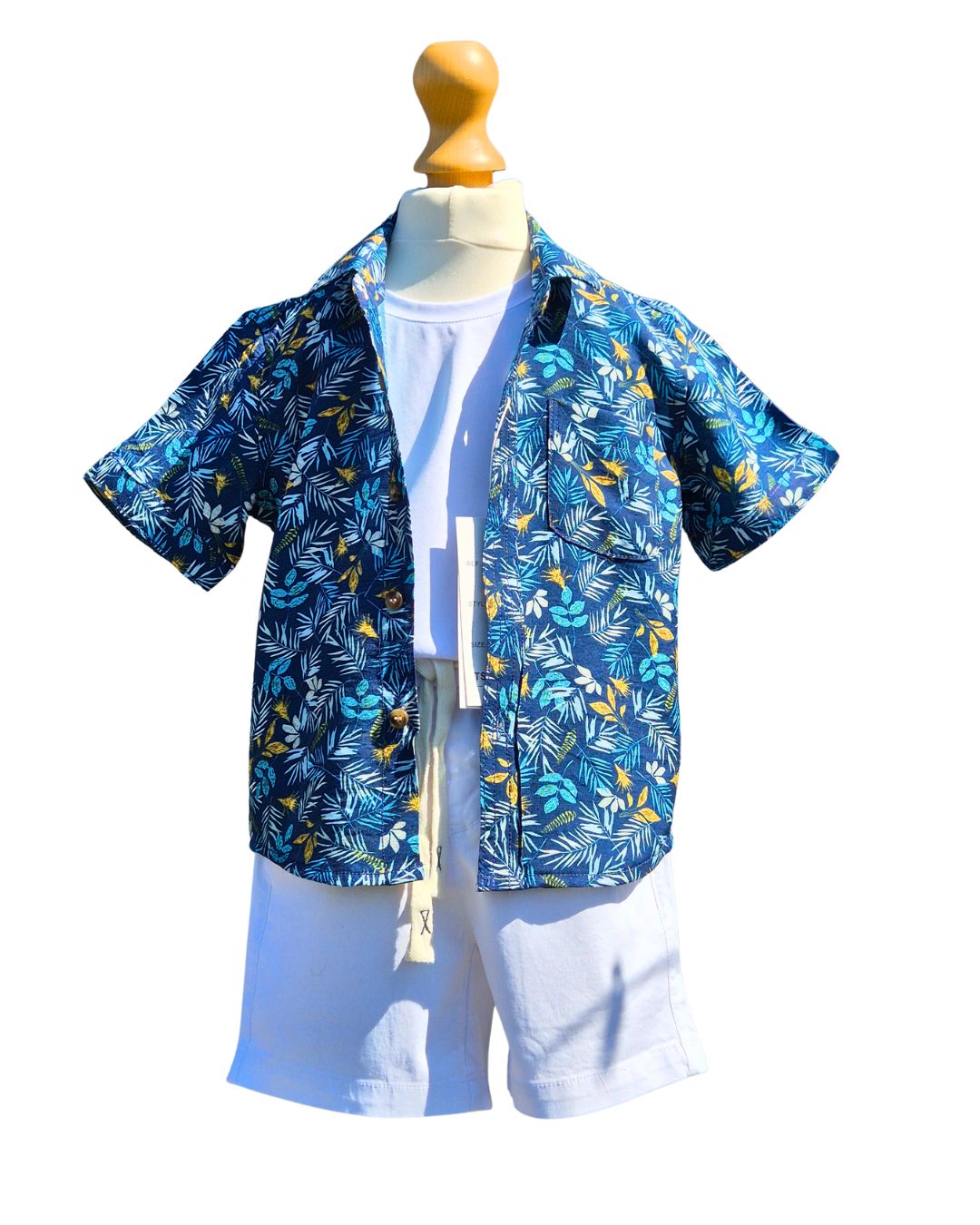 Boys summer outfit with white shorts and tropical shirt