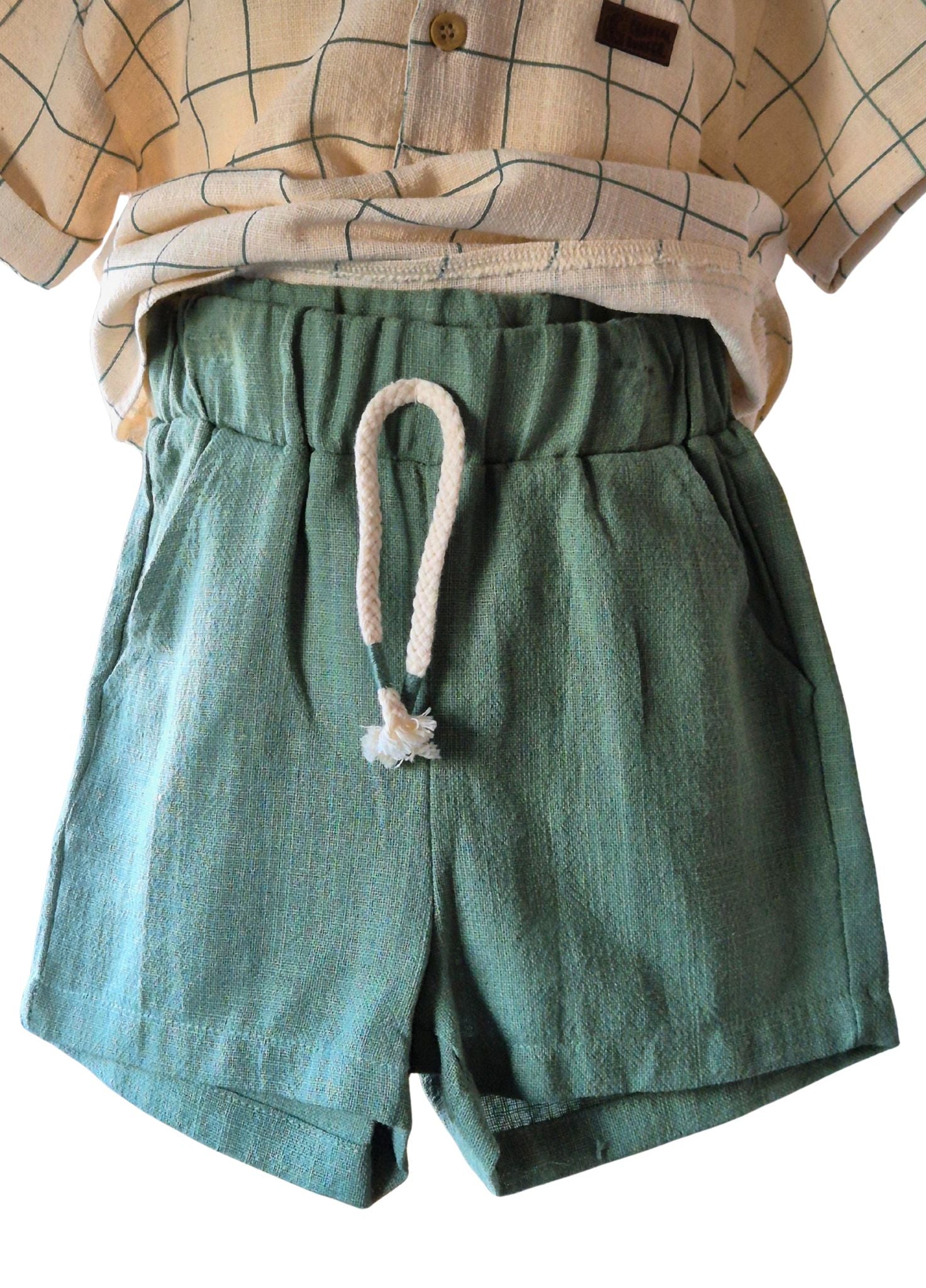 Green shorts with a drawstring on a white background
