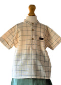 Plaid shirt on a mannequin with a white background