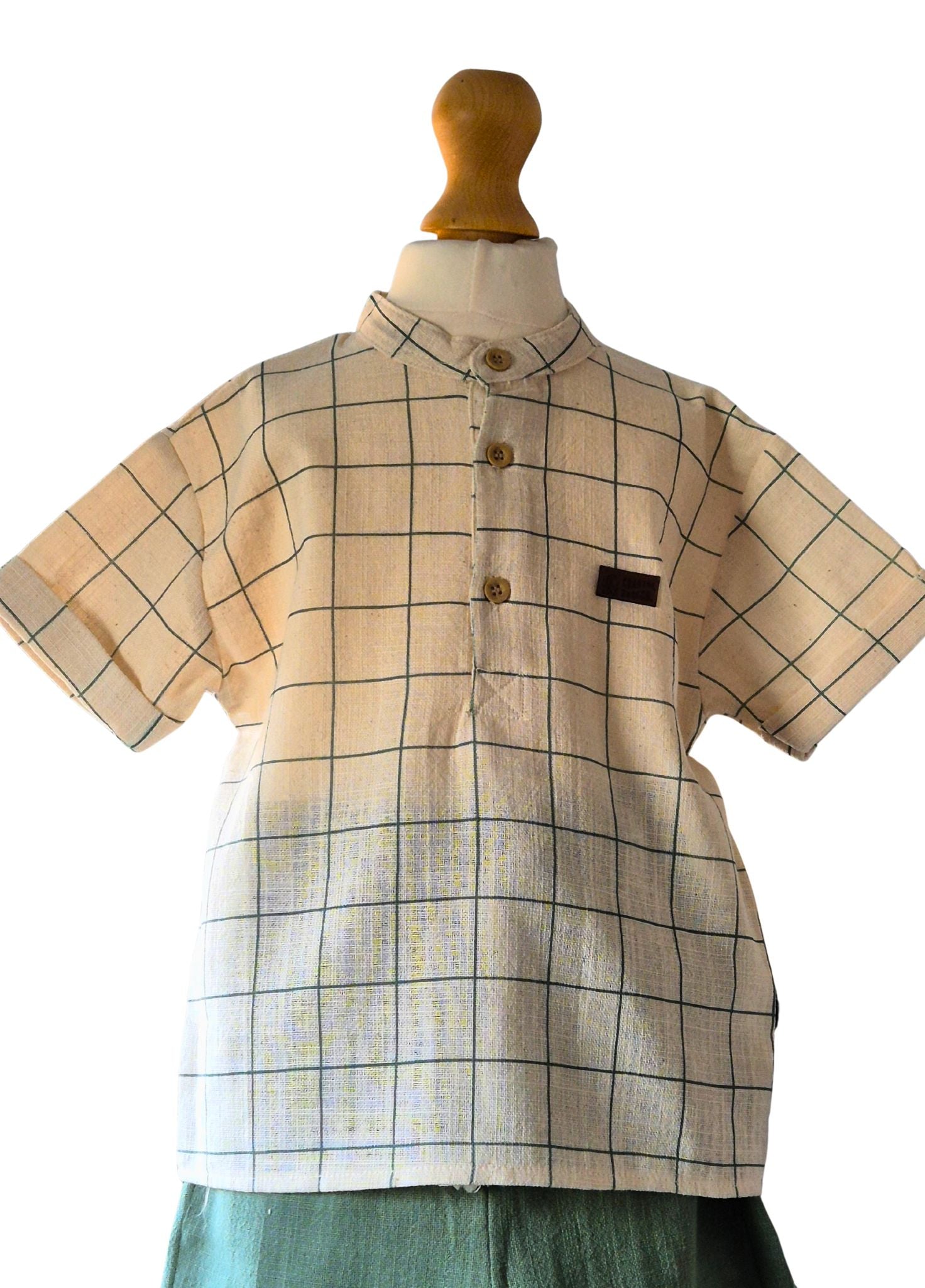 Plaid shirt on a mannequin with a white background