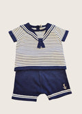 baby boys navy and white nautical sailor suit laid flat on a white background