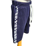 Navy blue shorts with white text and accents on a mannequin against a white background