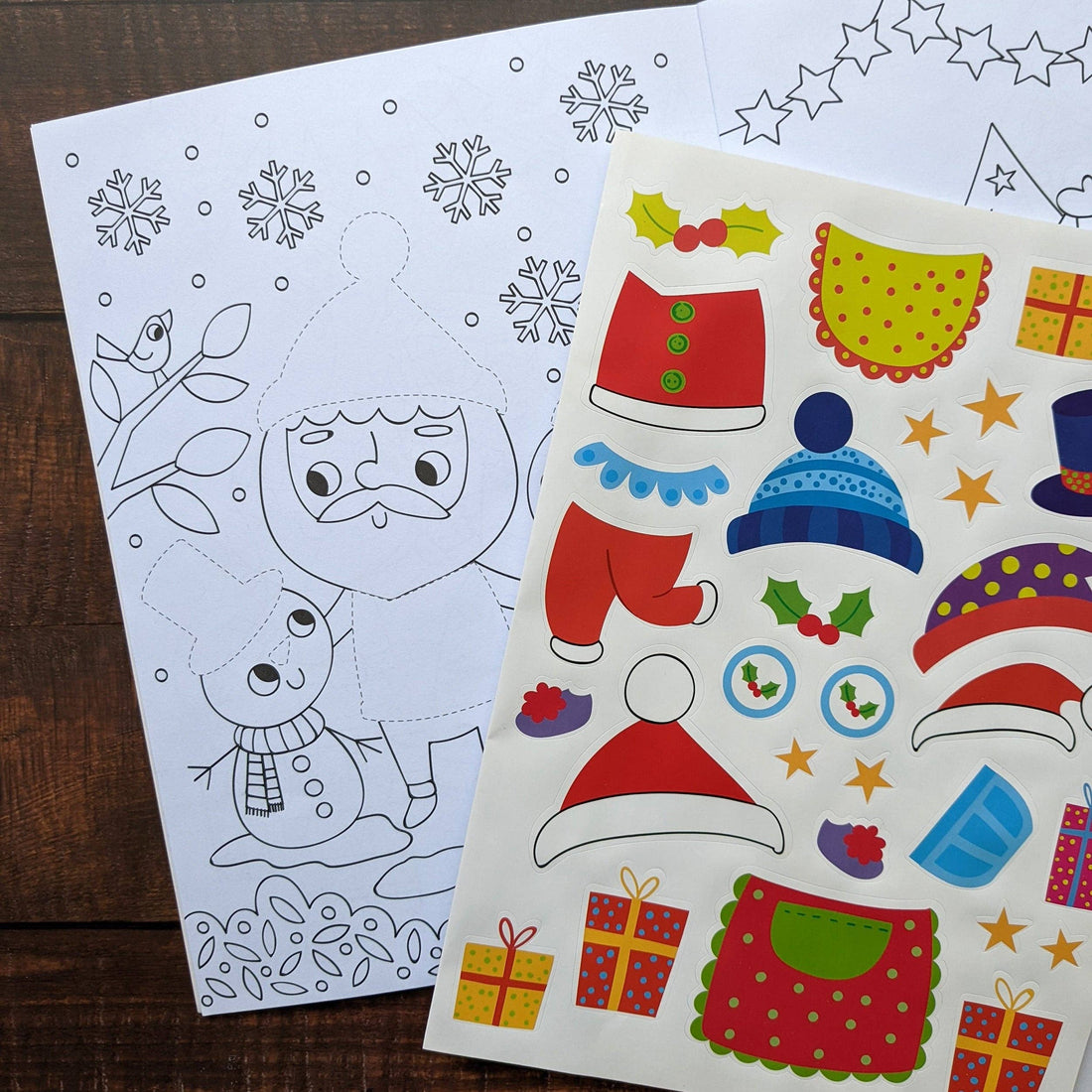 Book cover of 'Dress Me Up Santa' with a colorful illustration of Santa Claus, stickers, and festive elements on a blue background.