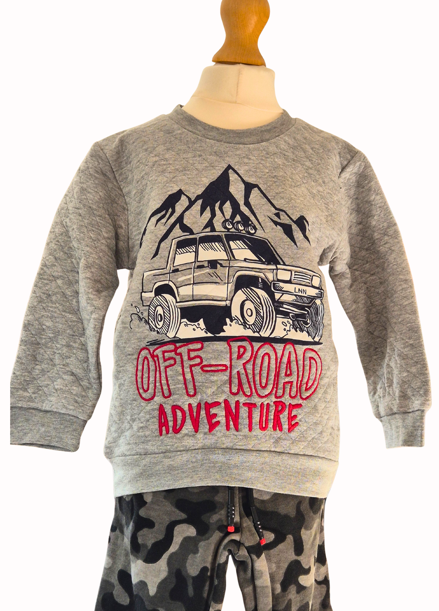 Gray sweatshirt with off-road adventure graphic on a mannequin against a white background