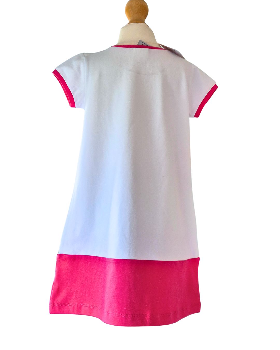 White dress with pink trim on a white background