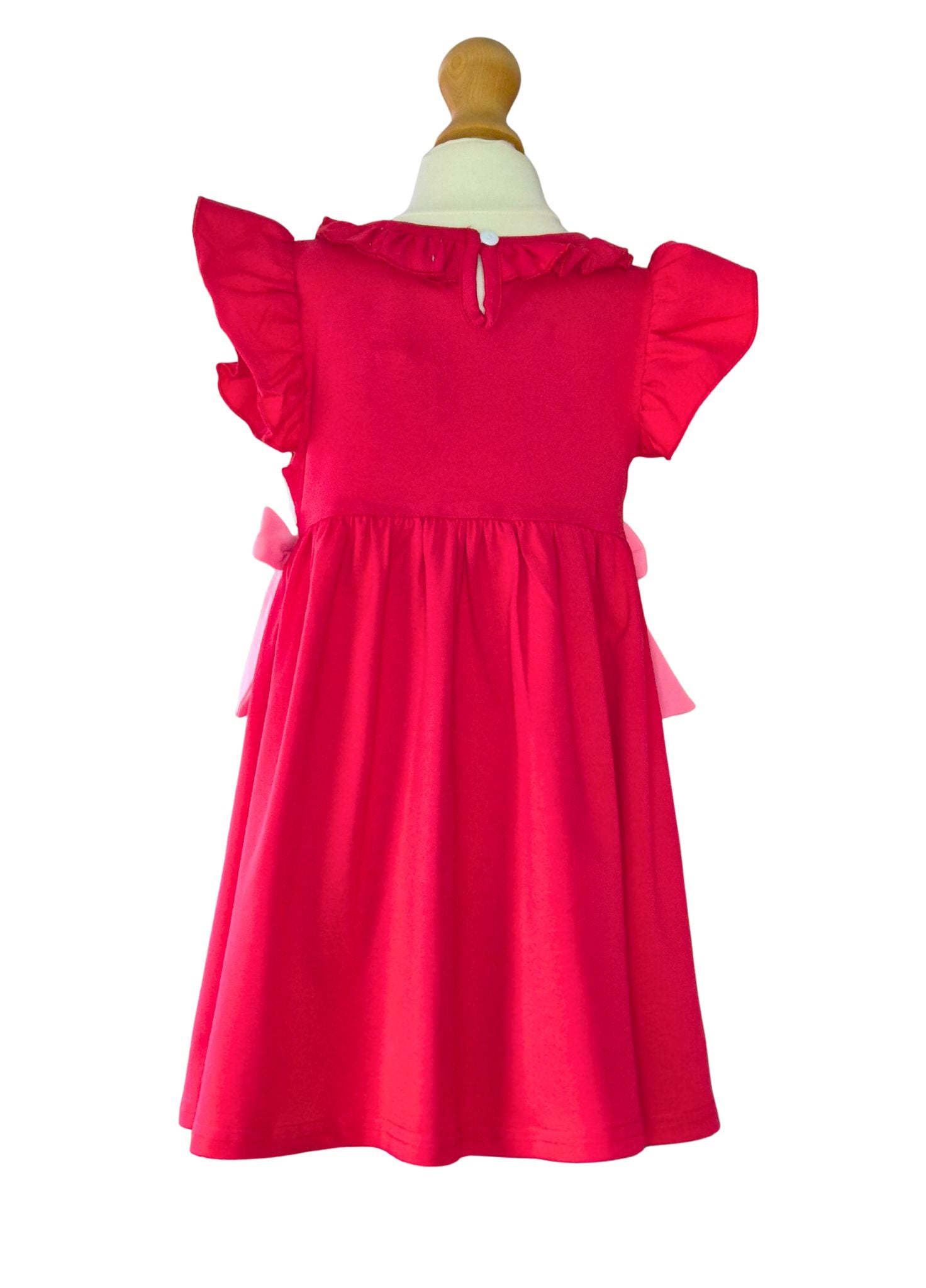 Red dress on a mannequin against a white background