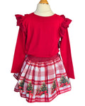 Girls’ Christmas Day outfit with red top and tartan-style skirt