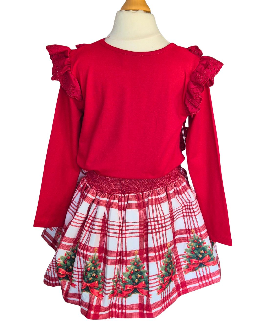 Girls’ Christmas Day outfit with red top and tartan-style skirt
