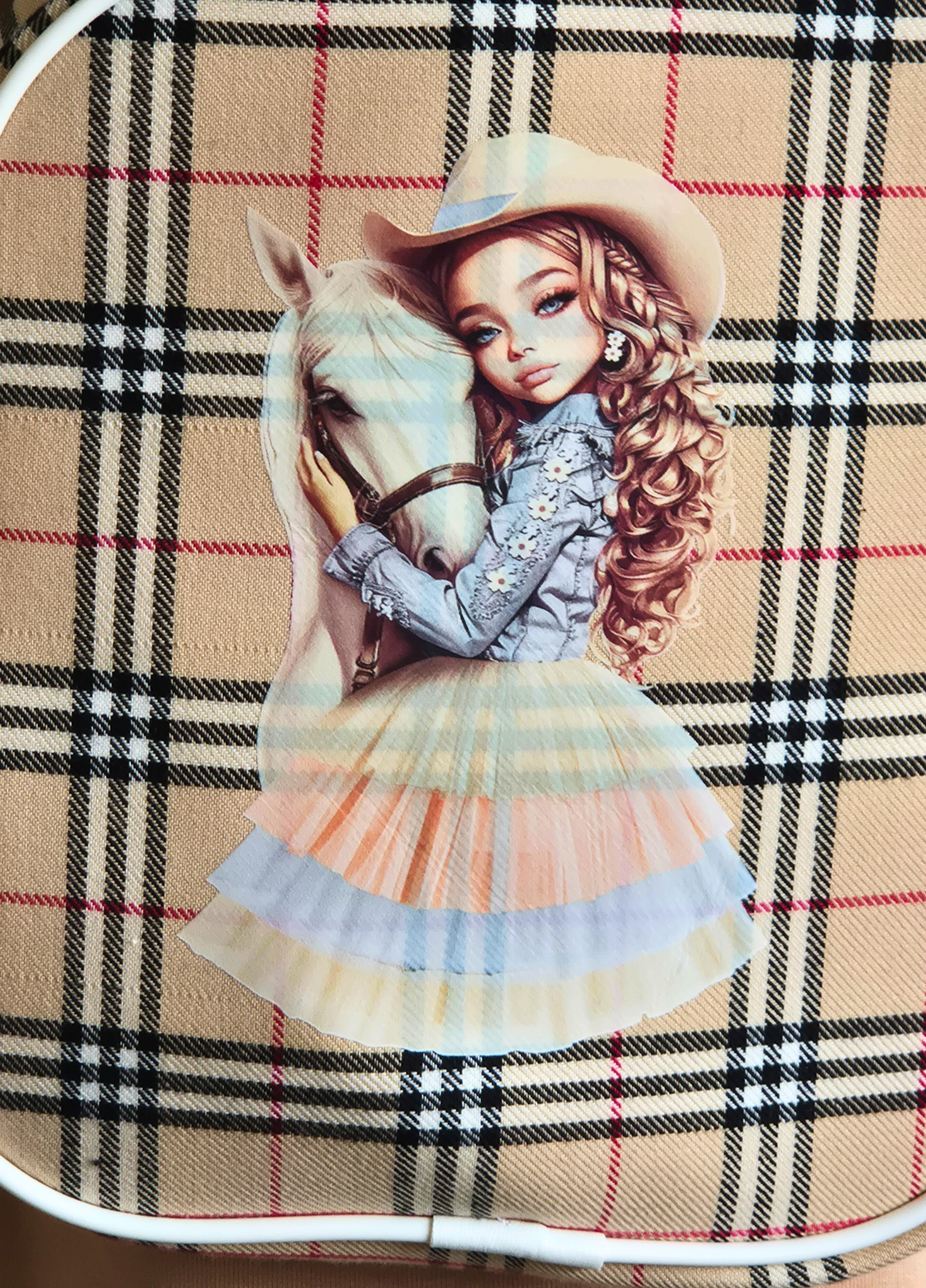 Backpack with a design of a girl in a cowboy hat and horse on a plaid background