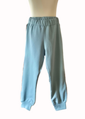 Light blue sweatpants on a mannequin against a white background
