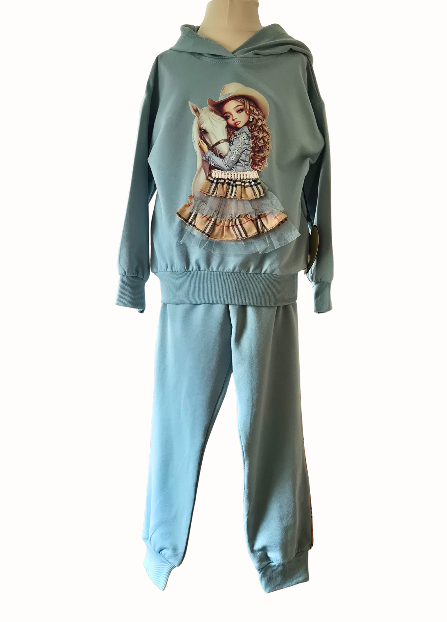 Light blue hoodie and pants set with graphic design on a mannequin against a white background