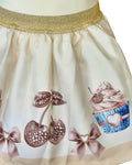 Girls cream skirt with cherry and cupcake details