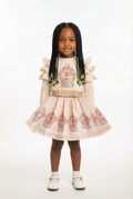 Co ordination cream sparkly cupcake top and skirt set on a young black girl.