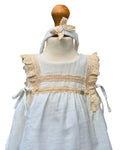 Baby girls cream dress with lace trim
