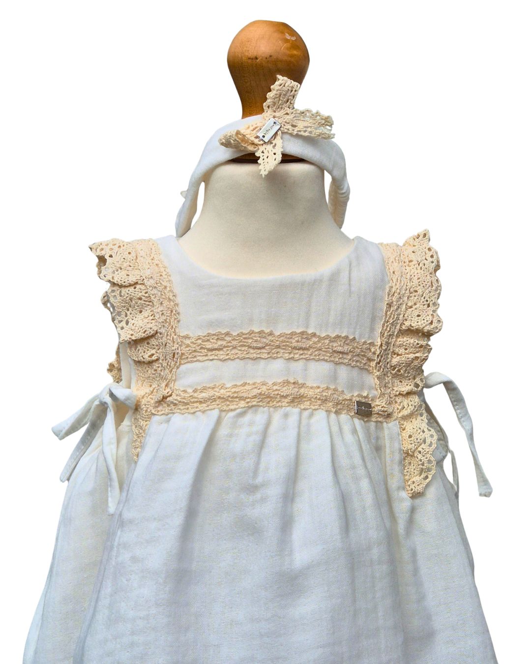 Baby girls cream dress with lace trim