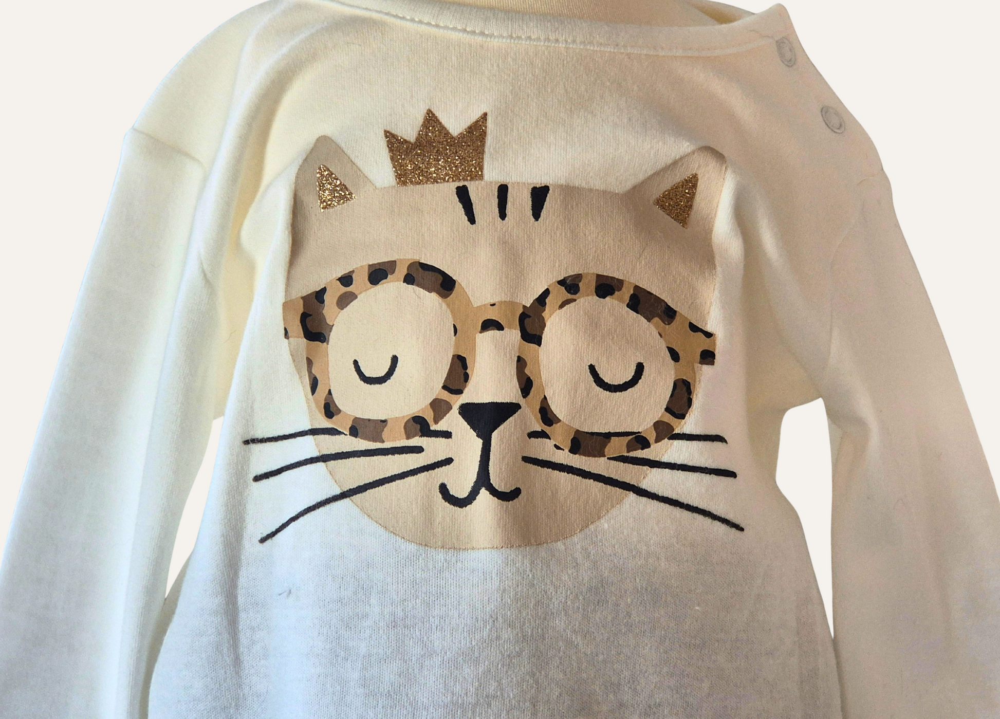 Close up of the long sleeved girls top which is part of the three piece set