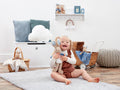 Child hugging her Peter Rabbit  in a nursery room