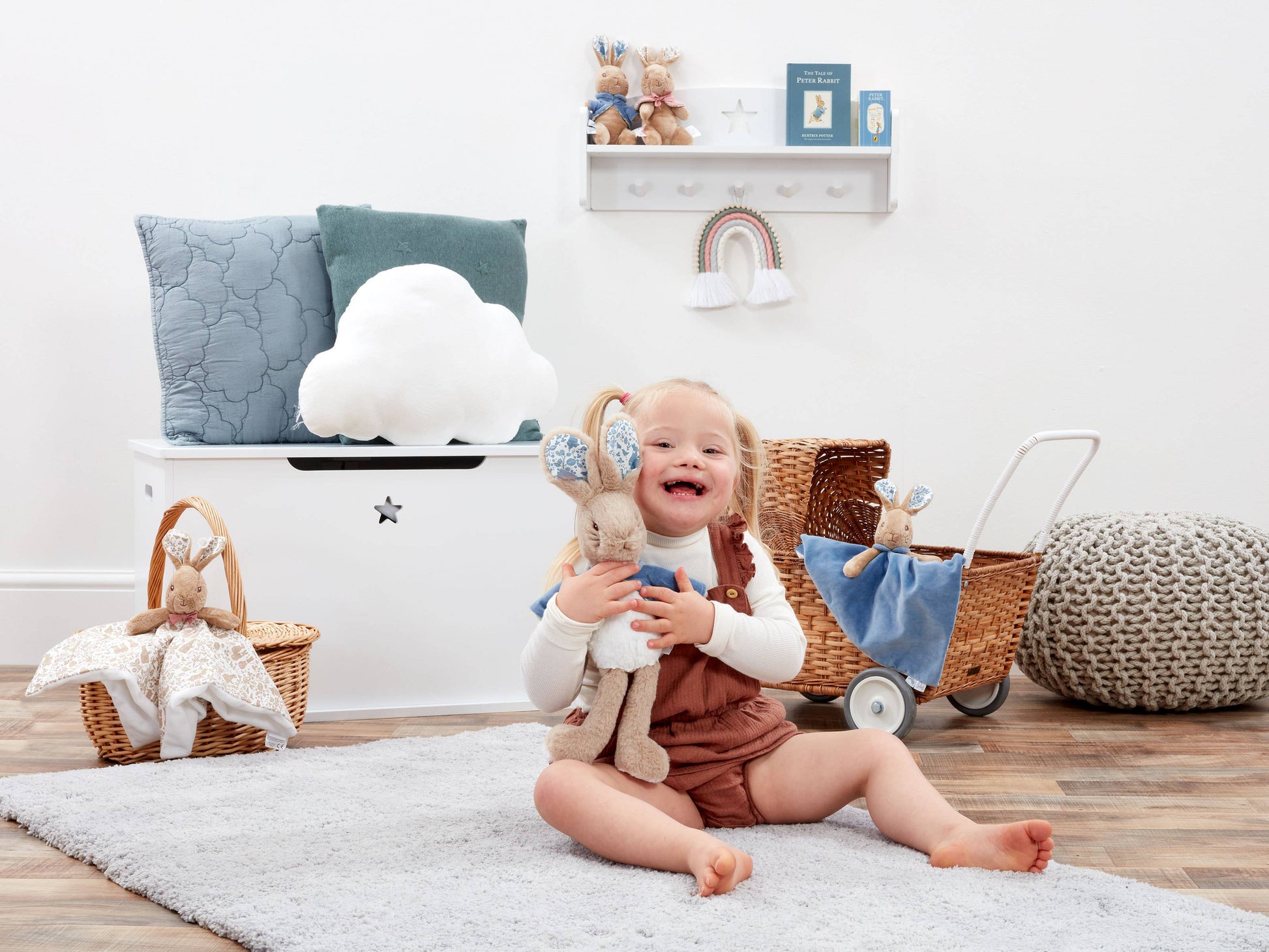 Child hugging her Peter Rabbit  in a nursery room